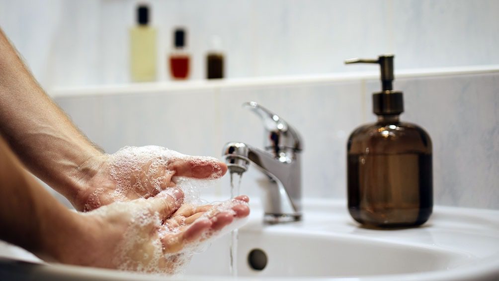 Washing hands at home in bathroom. Healthy lifestyle, hygiene and prevention viral and bacterial diseases.
